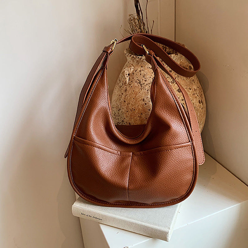 Modna torbica za čez ramo z nastavljivo naramnico in veliko prostornino